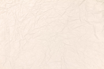 Recycled crumpled light brown paper texture or paper background for design with copy space for text or image.