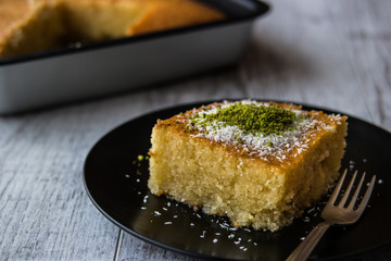Turkish Dessert Revani with pistachio powder.