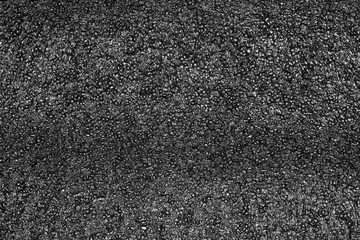Black plastic foam texture. Foam rubber texture for background.