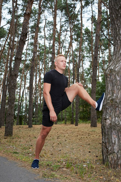 young athlete running in the forest