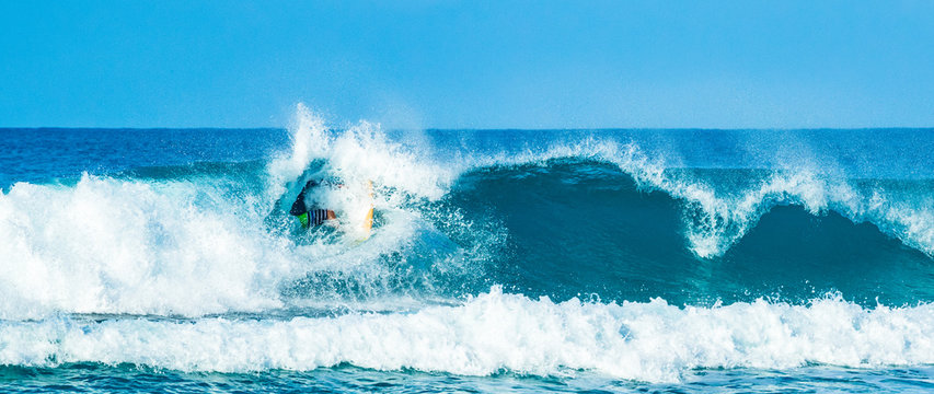 surfer in good waves in the caribbean