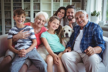 Portrait of happy family sitting on sofa 
