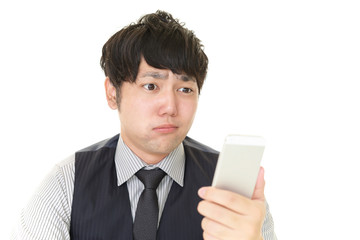 不安そうな表情のビジネスマン