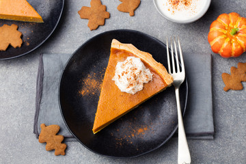 Pumpkin pie, tart with whipped cream on a plate