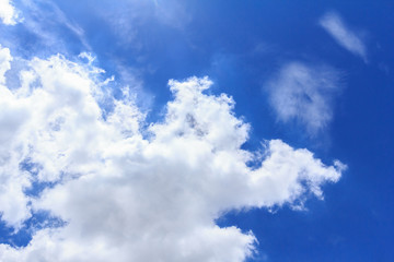 Fototapeta premium Blue sky background with white clouds. The vast blue sky and clouds sky on sunny day. White fluffy clouds in the blue sky.