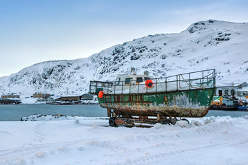 Old boat on the Bay, the fishing village of Teriberka, Murmansk oblast