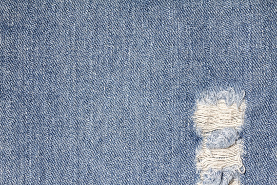 Denim jeans texture or denim jeans background with old torn. Old grunge vintage denim jeans. Stitched texture denim jeans background of jeans fashion design.