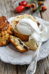 Scones with raisins and whipped cream.