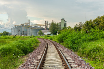 Fototapeta premium Railroad to industrial factory buildings