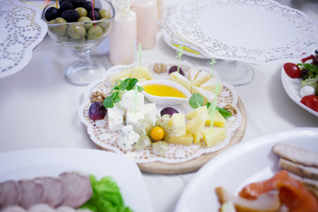 Appetizers. Various types of cheese, salami and prosciutto. Decorated table, buffet