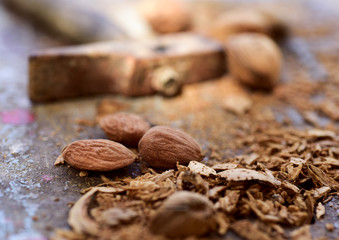 cracked almonds and hammer