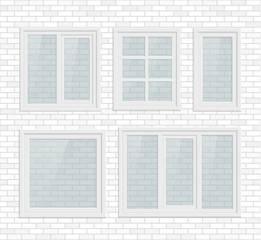 Set of transparent metal plastic windows on white brick wall