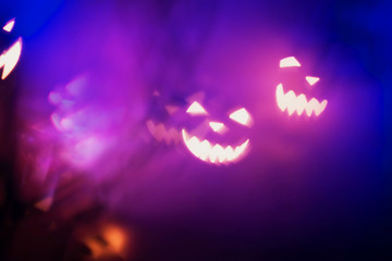 Halloween background. Halloween evil face made of shining lights
