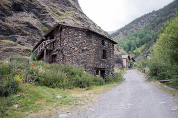 Fototapeta na wymiar Andorra Spain gate village village road stone house Pyrenees motorcycle tour