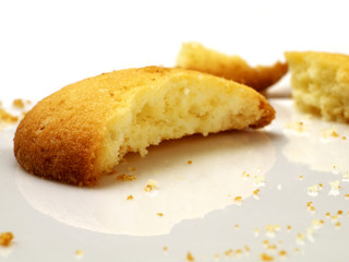 closeup of broken cookie on white plate, shallow depth of field