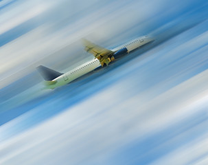 Fototapeta na wymiar The airplane in the blue sky
