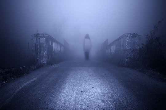 Horror female ghost in the mist