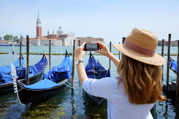 Fototapeta na wymiar Canal and gondolas with tourist eye