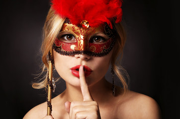 Girl with carnival mask. Beautiful young woman 