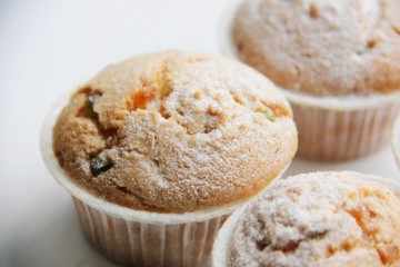 cupcakes with candied fruit on the table