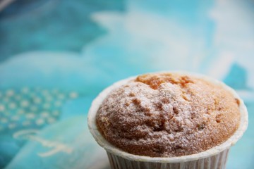 a cupcake with candied fruit on the table