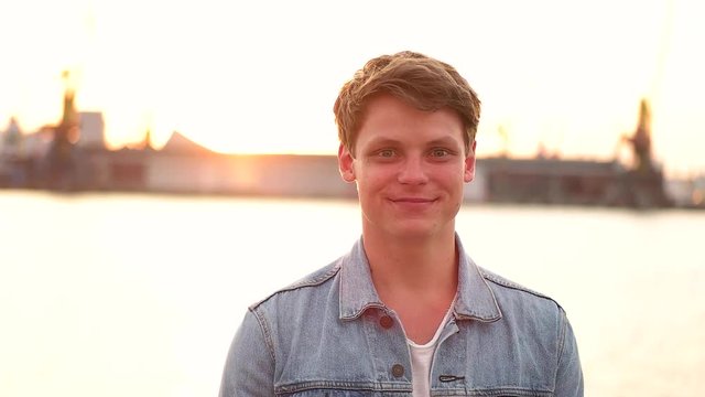 Man smiling on the city port background.