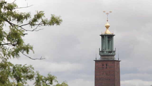 Stockholm City Hall Tower detail. The golden Three Crowns is the most famous silhouettes in Stockholm. The great Nobel banquet is held in City Hall.