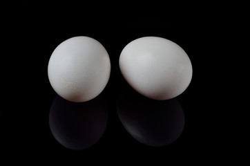 Boiled eggs on a black background.