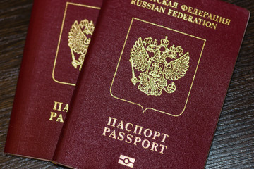 Russian passports isolated on wood background

