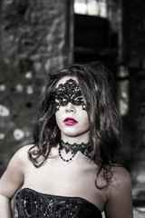 Portrait of beautiful young women with gothic mask black eyes