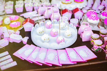 Dessert table at kids birthday party. Cake, candies, marshmallow