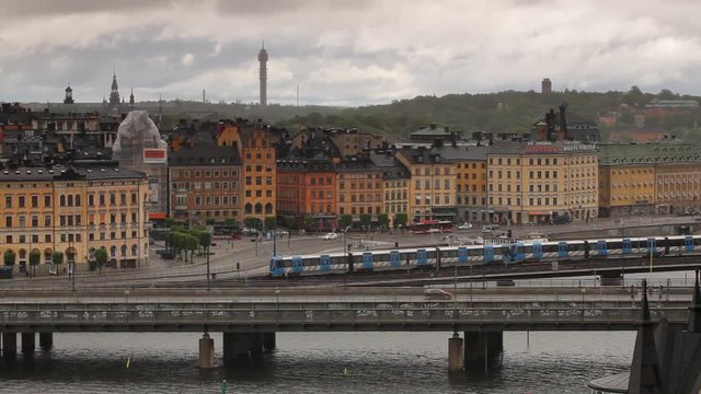 Stockholm view with traffic and subway train at foreground