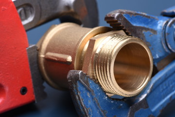 Brass fittings and wrench closeup