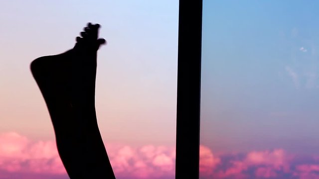 Silhouette In Shadow Of A Young Woman Legs