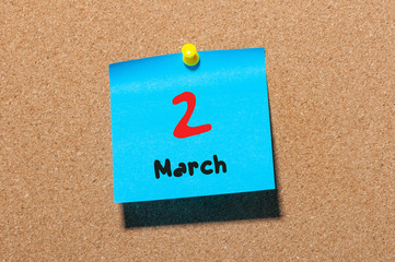 March 2nd. Day 2 of month, calendar on cork notice board background. Spring time, empty space for text