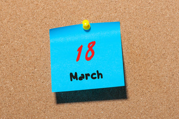 March 18st. Day 18 of month, calendar on cork notice board background. Spring time, empty space for text