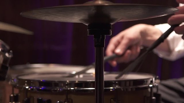 Big close up of playing drums with brushes (slow motion from 100fps)