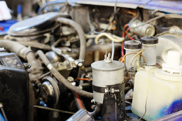 The image of a car engine under a hood