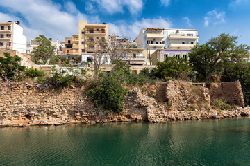 Obraz premium Greek houses on cliff of river channel at Sitia town on Crete island