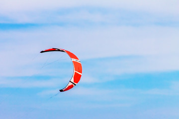 kitesurf in the blue sky with clouds, sports background