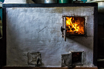 the old furnace in the house and the flames