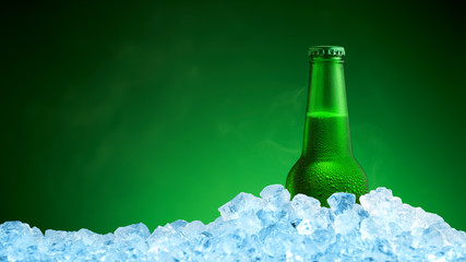 Bottle of cold beer in ice on green background - 123390726