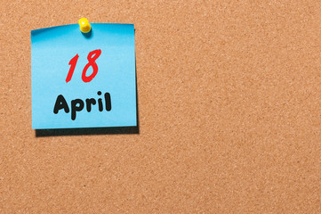 April 18st. Day 18 of month, calendar on cork notice board, business background. Spring time, empty space for text