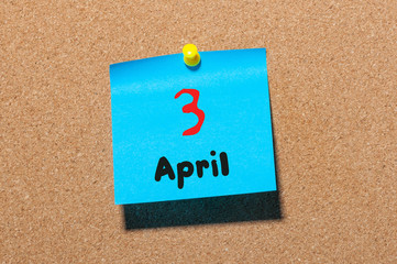 April 3rd. Day 3 of month, calendar on cork notice board, business background. Spring time, empty space for text