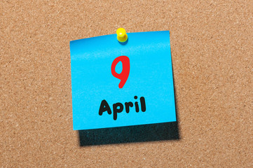 April 9th. Day 9 of month, calendar on cork notice board, business background. Spring time, empty space for text
