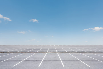 Empty parking lot on blue sky background © yotrakbutda