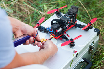 drone repairing on the field - obrazy, fototapety, plakaty