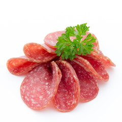 Salami smoked sausages slices isolated on white background.