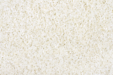 Fototapeta na wymiar Uncooked white rice background