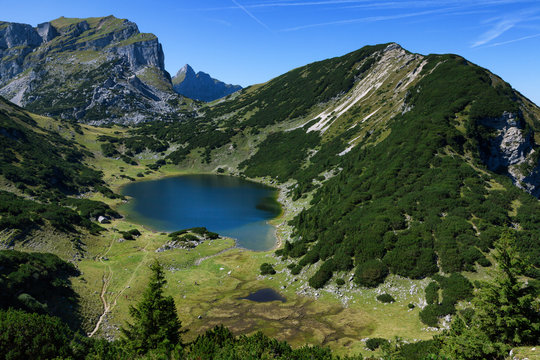 Mountains landscape with a little lake. Austria, Tyrol, Lake Zirein.
